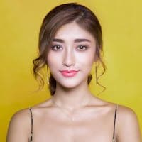 Woman on yellow backdrop